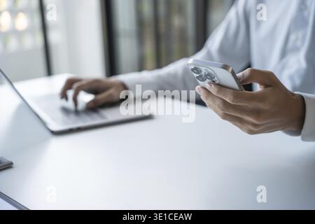 Successful Businessman Using Smartphone During Office Work Stock Photo