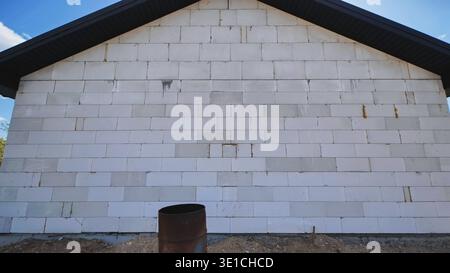 Building house wall using aerated concrete technology for modern construction Stock Photo