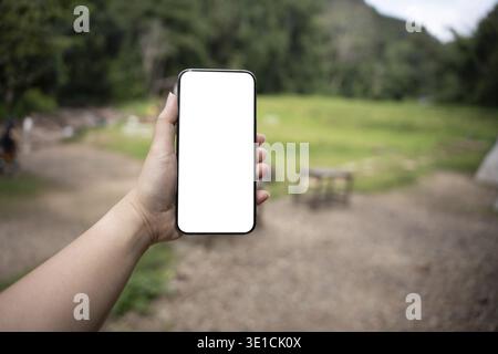 Smart phone mockup. Women hands holding cell telephone blank copy space screen smartphone blank white screen isolated technology Stock Photo