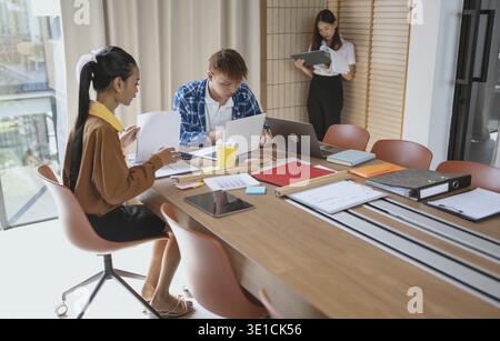 Group of business people LGBTQ+ Diverse Team meeting collaborating new project in office Stock Photo