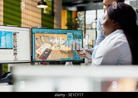 Team of designers developing digital 3D architecture model with CAD tools and software. Architect and worker uses interface to render apartment layout and prepare floor plan blueprints. Stock Photo