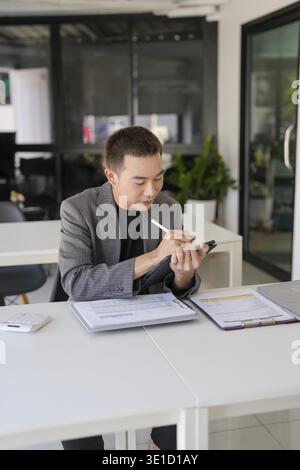 Business man working on tablet presses on screen digital tablet Online Digital marketing technology Stock Photo