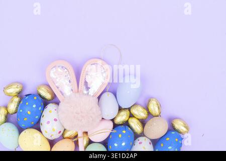 Easter scene with colored eggs and rabbit's ears Stock Photo