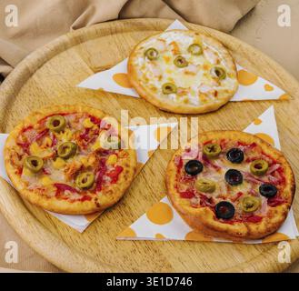 Appetizing display of burgers, pizzas, and fries, ready for a tasty meal Stock Photo
