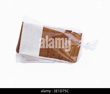 Clear plastic bag containing slices of fresh brown bread, isolated on a white background Stock Photo