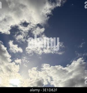 Sun's Rays Breaking Through Mixed Cloud Formations Stock Photo