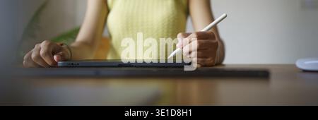 Graphic designer working on digital tablet. artist drawing on graphic tablet and Color swatch samples. Artist Creative Designer sketch graphic drawing Stock Photo
