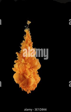 Orange Acrylic colors ink in water isolated Abstract and bright. subject photo, cosmetics, drinks and advertising concept Stock Photo