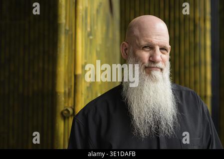 Portrait of mature bald man with long gray beard Stock Photo