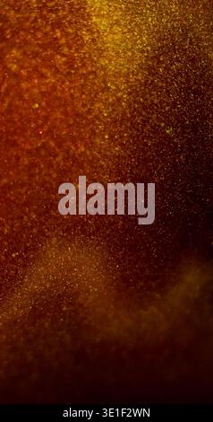 Bokeh light. Glint texture. Gleam orange yellow colorful glitter optical shimmer twinkle shiny flash on abstract dazzle background. Stock Photo