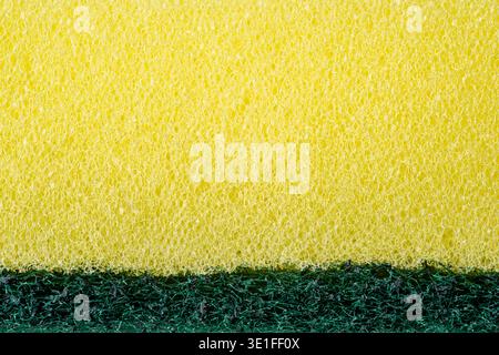 Yellow kitchen sponge macro texture with porous cleaning surface pattern Stock Photo