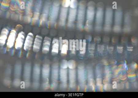 Defocused silver and gray abstract background with shimmering reflections, soft bokeh highlights, and a metallic texture. Ideal for modern design, lux Stock Photo