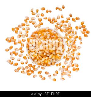 Dry corn seeds in bowl on white background Stock Photo