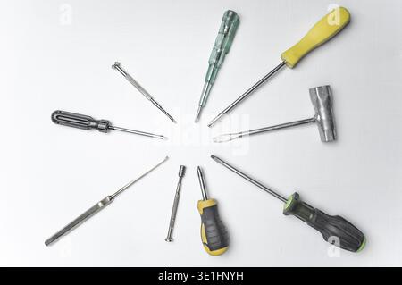 Different old screwdrivers on a white background. Cross, minus and with a rubber handle against electric shock. High quality photo Stock Photo