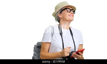 Woman traveling with camera and phone looking away Stock Photo
