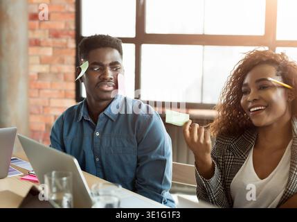 Shocked black man with stickers on face Stock Photo