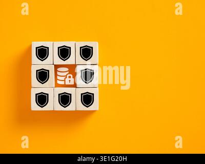 Database data secured with a lock icon surrounded by shield icons, representing strong data protection measures Stock Photo