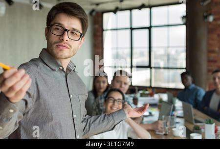 Business man making presentation for colleagues at office Stock Photo