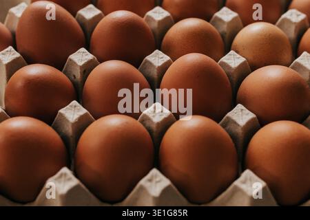 Close up overhead shot of carton of brown eggs Stock Photo
