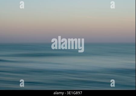 Abstract long exposure of blue ocean with copy space for text Stock Photo