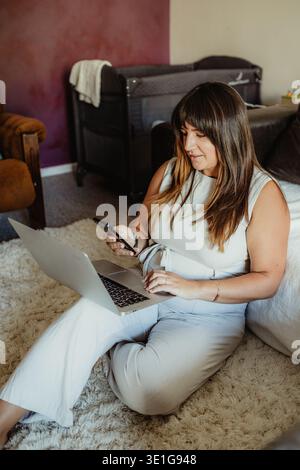 Woman working remotely from home Stock Photo