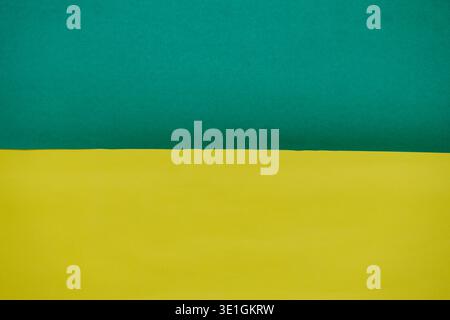 A vibrant background featuring a distinct horizontal division between bright green and yellow colors, suitable for design projects. Stock Photo