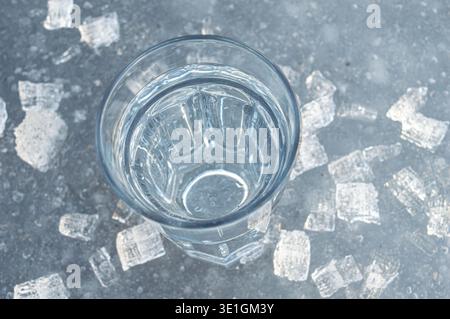 Beautiful transparent different pieces of ice on the ice surface. Pieces of ice filled with bubbles, a solid background. dishes, frozen water is clean Stock Photo