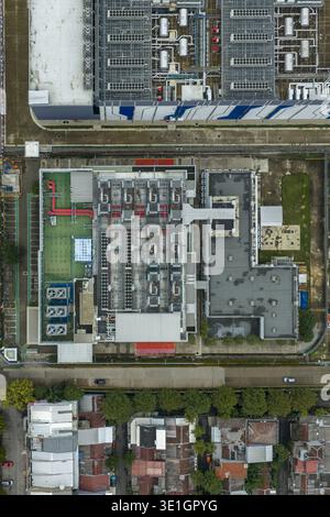 Aerial view of a modern datacenter infrastructure building, next to residential areas, Jakarta, Indonesia. Stock Photo