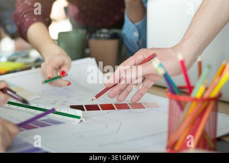 Creative designers working with color samples for selection Stock Photo