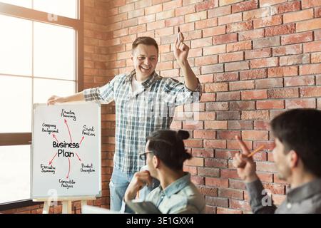 Young team discussing project in modern office Stock Photo