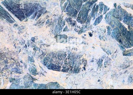 Marble texture background. Blue breccia marble or serpentinite stone surface backdrop. Stock Photo