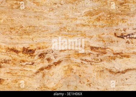 Real stone background. Golden beige travertine natural stone texture background for use on ceramic tiles or as digital background. Stock Photo