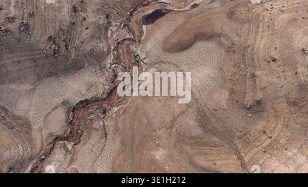 Drone shot over the dried up lake area. Soil Terrain Aerial View, Sandy Background Stock Photo