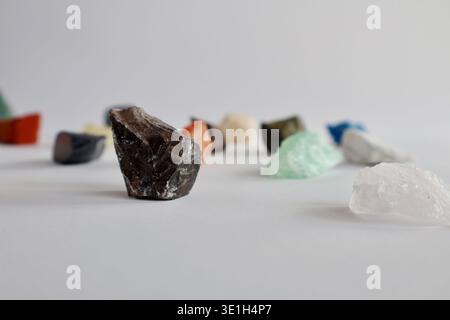 Collection of various raw colorful gemstones and minerals on a white background Stock Photo