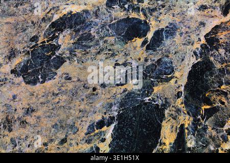 Marble texture background. Dark breccia marble or serpentinite stone surface backdrop. Stock Photo