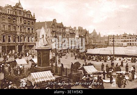 The Market Place in Nottingham, England, with covered stalls, people and  buildings surrounding the market. From an original postcard published by Francis Frith, around 1911. Stock Photo