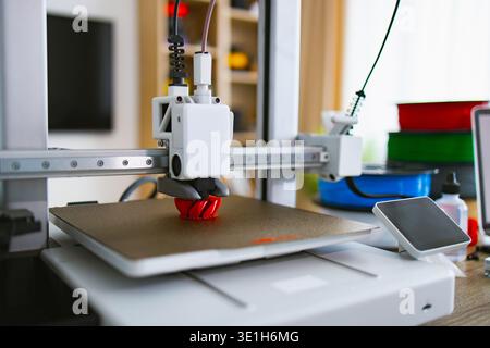 3D Printer Creating Red Object Stock Photo