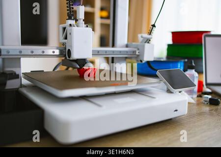 3D Printer Creating Red Object Stock Photo