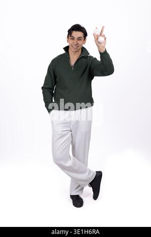 Young man showing victory sign gesture with hand Stock Photo