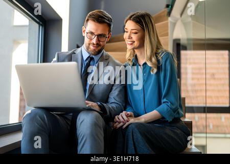 Mixed team of software engineers brainstorming ideas. Diverse app developers collaborating as group Stock Photo