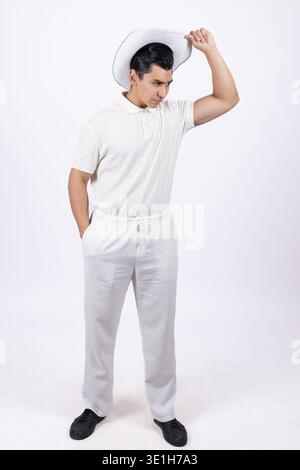 Young man leaning back with hand on head posing Stock Photo