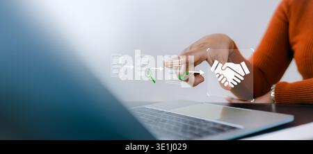 Businesswoman using laptop with digital workflow icons showing document processing and handshake. Concept of smart contract, automation, and document Stock Photo