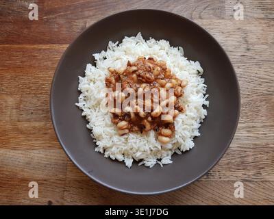 Black-eyed beans or black-eyed peas served with rice pilaf.  A Turkish dish. Beans cooked with minced meat, onion and tomato paste Stock Photo