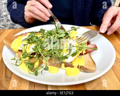 A plate of eggs Benedict for breakfast. Stock Photo