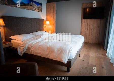 Upscale lodge bedroom in San Domenico, Italian Alps, minimalist style Stock Photo