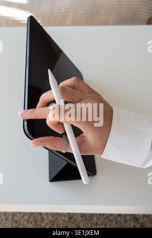 Tablet Activation – Female Hand Holding Stylus and Pressing On Button, Technology and Creativity Stock Photo