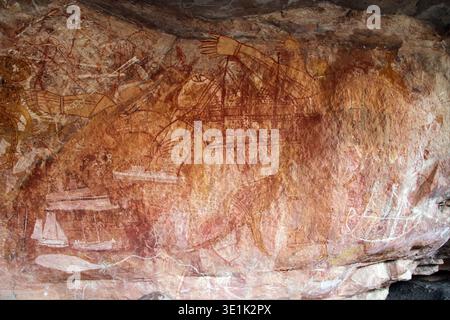 Aboriginal rock art depicts figures of Mimi Spirits on a cave wall ...