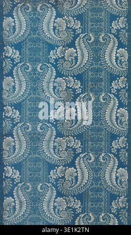This antique 'Sydewall' wallpaper from the late 17th or early 18th century features a baroque-style pattern in shades of blue and white. The intricate design includes large, ornate floral and foliate motifs, likely block-printed, characteristic of historical textile and interior decor. Stock Photo