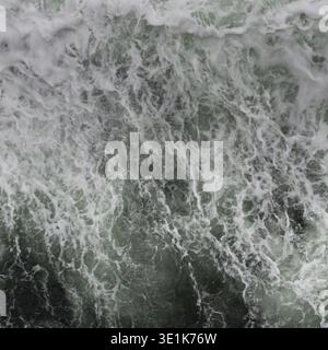 Big water splash seen from above a boat Stock Photo