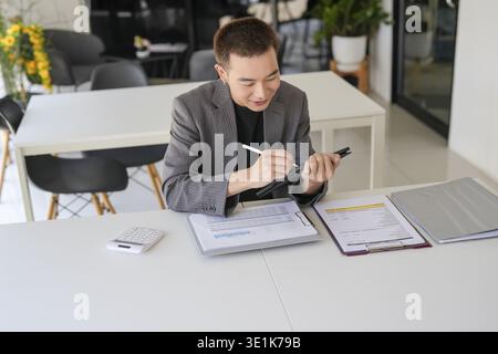 Business man working on tablet presses on screen digital tablet Online Digital marketing technology Stock Photo